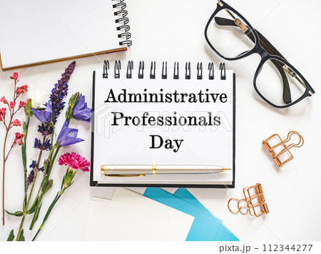 Happy Administrative Professionals Day. Notepad with congratulatory inscriptions Happy Administrative Professionals Day. Notepad with congratulatory inscriptions 112344277