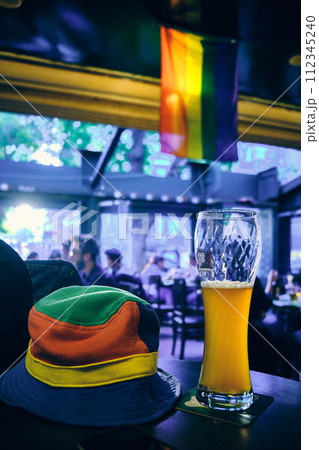 Colorful hat, beer glass and pride flag Colorful hat, beer glass and pride flag 112345240