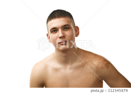 Portrait of handsome young guy with well-kept skin standing shirtless and looking at camera isolated over white studio background Portrait of handsome young guy with well-kept skin standing shirtless and looking at camera isolated over white studio background 112345879
