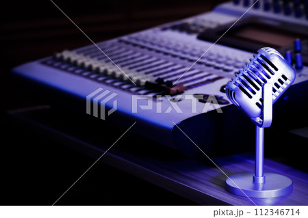 retro microphone and digital audio mixer console. recording, broadcasting concept 112346714