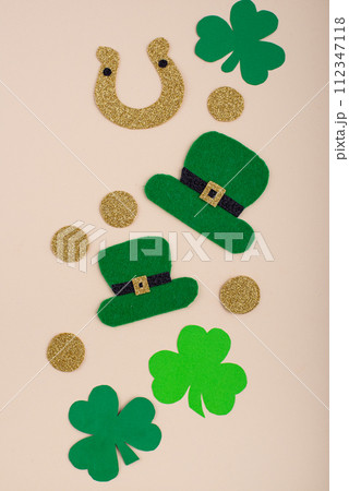 St. Patrick's Day concept with leprechaun hat, gold coins and horseshoe St. Patrick's Day concept with leprechaun hat, gold coins and horseshoe 112347118