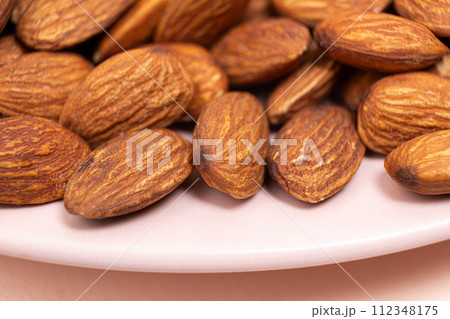 A lot of roasted nuts almond macro A lot of roasted nuts almond macro 112348175