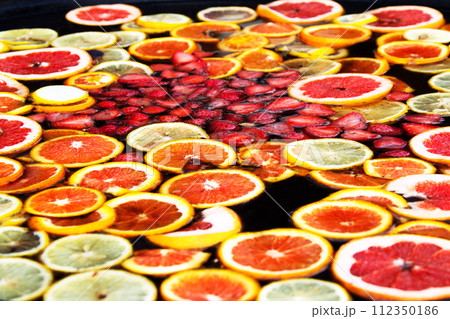 Compote of fruits. Fruit water. Russian sbiten. Compote of orange and strawberries. 112350186