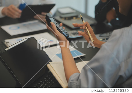 Business team collaboration discussing working analyzing with financial data and marketing growth report graph in team, presentation and brainstorming to strategy planning making profit of company. 112350580