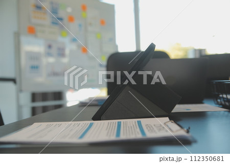Laptop on a desk in an open financial office. Laptop on a desk in an open financial office. 112350681