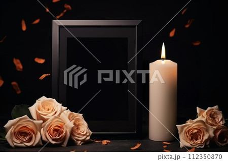 AI-generated content.  black picture frame roses falling leaves white candle dark background copy space 112350870