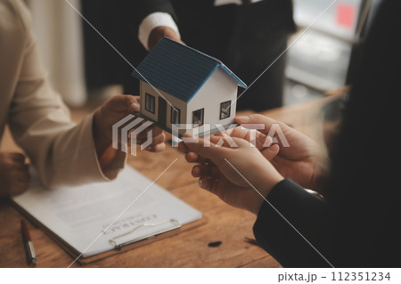 Real estate agent and Sales manager team analysis pricing of rental lease contract of sale purchase agreement, concerning mortgage loan offer for and house insurance. 112351234