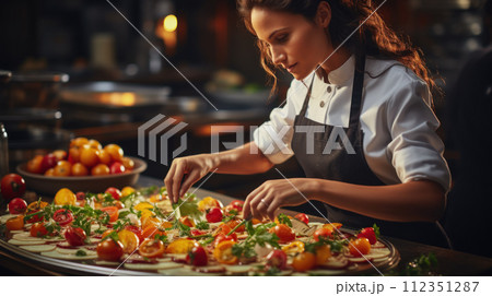A professional restaurant chef prepares pizza  112351287