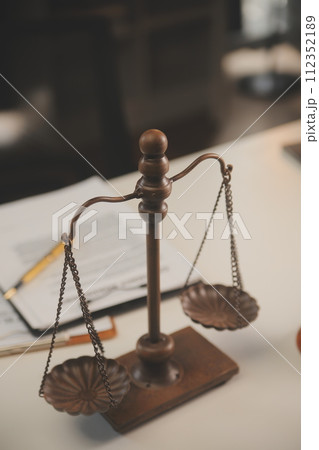 image of judge's hammer, scales lady of justice, law book, laptop computer and contract documents with pen concept of law and justice. 112352189