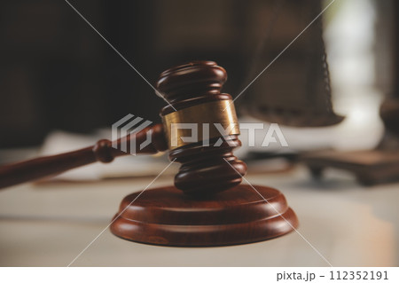 image of judge's hammer, scales lady of justice, law book, laptop computer and contract documents with pen concept of law and justice. 112352191