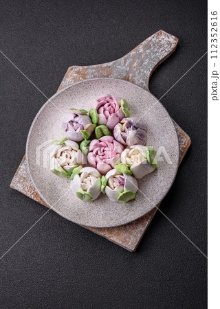 Beautiful tasty marshmallows in the form of tulip buds Beautiful tasty marshmallows in the form of tulip buds 112352616