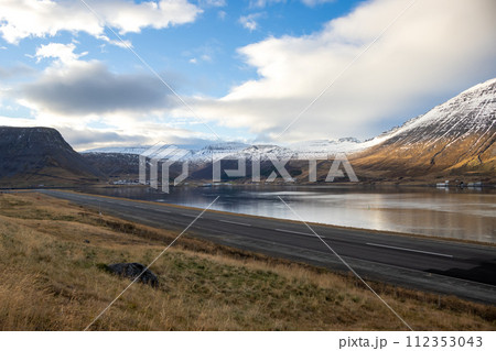 Fjord, mountains and cloudy sky, Iceland 112353043