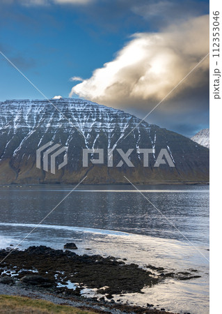 Fjord, mountains and cloudy sky, Iceland 112353046