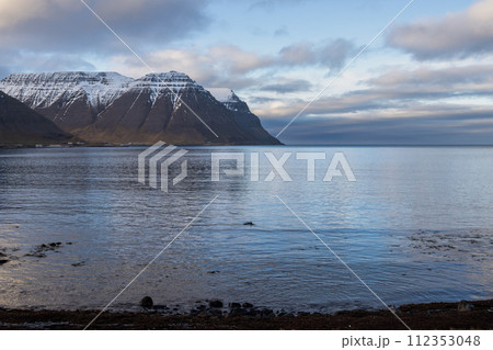 Fjord, mountains and cloudy sky, Iceland Fjord, mountains and cloudy sky, Iceland 112353048