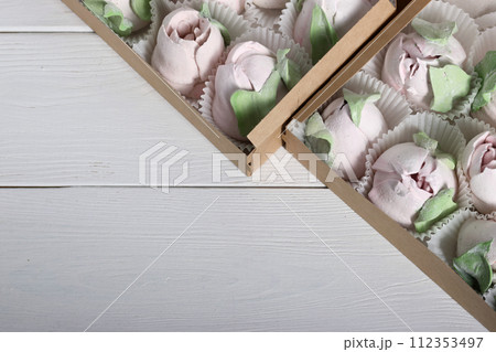 Marshmallows in gift boxes. Marshmallow flowers. Homemade marshmallows. Close-up. Marshmallows in gift boxes. Marshmallow flowers. Homemade marshmallows. Close-up. 112353497