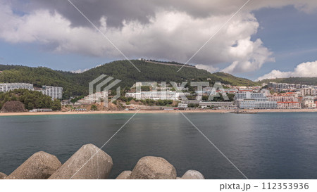 Panorama showing view of Sesimbra Town and Port timelapse, Portugal. Panorama showing view of Sesimbra Town and Port timelapse, Portugal. 112353936