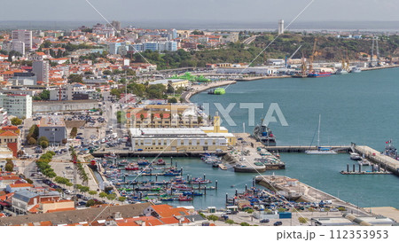 Aerial view of marina and city center timelapse in Setubal, Portugal. Aerial view of marina and city center timelapse in Setubal, Portugal. 112353953