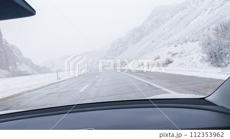 POV-Electric vehicle is captured deftly navigating the I-70 highway during a winter storm in Western Colorado. POV-Electric vehicle is captured deftly navigating the I-70 highway during a winter storm in Western Colorado. 112353962