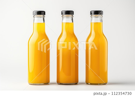 Several bottles of fresh apple juice on white background isolated Several bottles of fresh apple juice on white background isolated 112354730