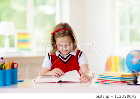Kids doing homework. Children go back to school. Kids doing homework. Children go back to school. 112358045