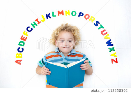 Child learning letters of alphabet and reading Child learning letters of alphabet and reading 112358592
