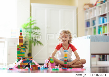 Child playing with toy blocks. Toys for kids. Child playing with toy blocks. Toys for kids. 112363681