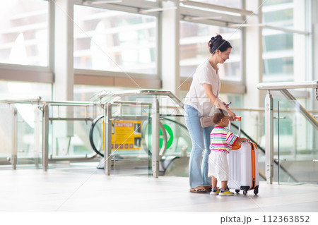 Family in airport. Kids fly. Travel with child. Family in airport. Kids fly. Travel with child. 112363852