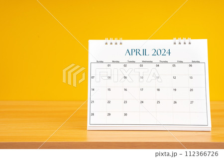 April 2024, Monthly desk calendar for 2024 year on wooden table. 112366726