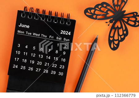 June 2024 desk calendar for the organizer to plan and reminder and butterfly paper. 112366779