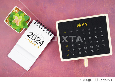 Calendar for May 2024 in black chalkboard on red background. Calendar for May 2024 in black chalkboard on red background. 112366894