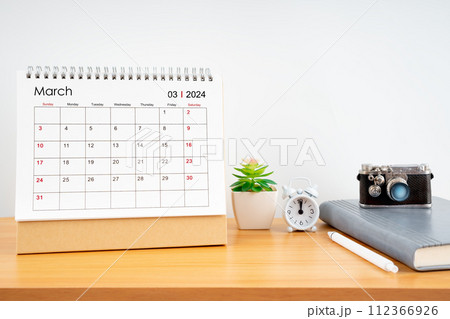 Desktop Calendar for March 2024 year and vintage camera with diary for Planner to plan timetable. 112366926