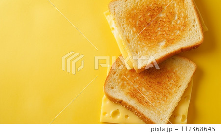 toast with cheese, pastel yellow background,copy space 112368645