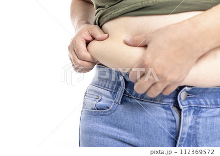 fat woman, fat belly, obese woman hand holding excessive belly fat 112369572