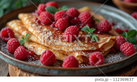 sweet pancakes with raspberries in a plate 112369637