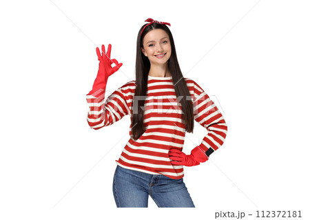 Portrait of a young housewife girl, on a gray background. 112372181