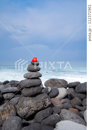 Balance stone tower on sea shore Balance stone tower on sea shore 112372901