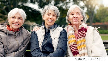 Senior, women and friends laugh in park with face and retirement smile in a garden. Nature, portrait and hug with elderly female people on vacation in woods feeling happy from bonding and freedom 112374182