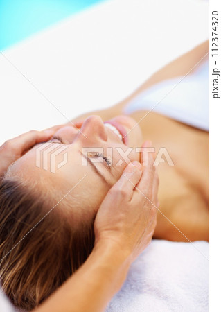 Woman, spa and face massage with therapist for wellness, holistic therapy and reiki at holiday resort. Beauty, skincare and happy client for facial acupressure, zen treatment and relax on vacation Woman, spa and face massage with therapist for wellness, holistic therapy and reiki at holiday resort. Beauty, skincare and happy client for facial acupressure, zen treatment and relax on vacation 112374320