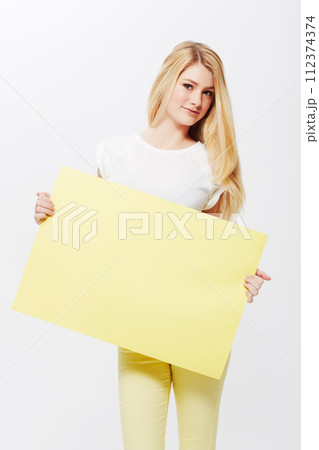 Woman, portrait and placard or mockup space in studio or poster deal for recommendation, communication or white background. Female person, face and blank paper for news bulletin, message or billboard 112374374