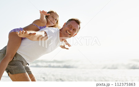 Father, child and airplane game on beach holiday together or playing flying on summer vacation, bonding or travel. Man, daughter and happy at ocean on back in Florida for island, relax or outdoor 112375863