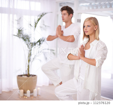 Yoga, balance and couple with hands in prayer for wellness, mindfulness and training in home. Mental health, peace and man and woman for workout, holistic healing and zen energy in living room Yoga, balance and couple with hands in prayer for wellness, mindfulness and training in home. Mental health, peace and man and woman for workout, holistic healing and zen energy in living room 112376120