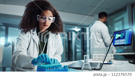 Woman, scientist or blood vial for exam in laboratory, healthcare or pathology to label on test tube. Biotechnology, pharmaceutical and laptop by doctor and online scientific results in phlebotomy 112376570