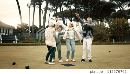 Bowls, celebration and hugging with senior friends outdoor, cheering together during a game. Motivation, support or applause and a group of elderly people clapping while having fun with a hobby Bowls, celebration and hugging with senior friends outdoor, cheering together during a game. Motivation, support or applause and a group of elderly people clapping while having fun with a hobby 112376761
