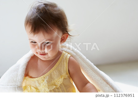 Baby, blanket and playing on floor, child development and infant growth with face, sitting and home. Girl, joyful and healthy in good mood, childhood and cheerful with enthusiasm, kid and adorable 112376951