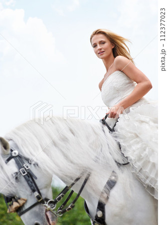Wedding, woman and portrait with riding horse outdoor on grass for celebration, marriage or confidence on mockup. Bride, face and stallion on lawn in field with smile, dress and animal at ceremony 112377023