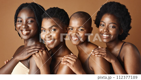 Face, beauty and smile with black woman friends in studio on a brown background for natural wellness. Portrait, skincare and happy with a group of people looking confident at antiaging treatment 112377189