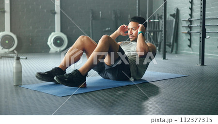 Exercise abdomen training, man and fitness body workout in gym. Young Asian person athlete, healthy sports wellness goal and core muscle power crossfit motivation on yoga mat in health studio 112377315