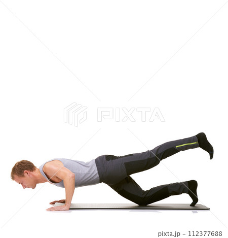 Man, pilates and mat in studio for stretching legs, fitness or workout for healthy body, wellness or core muscle. Person, exercise and yoga on floor for abdomen on mockup space or white background Man, pilates and mat in studio for stretching legs, fitness or workout for healthy body, wellness or core muscle. Person, exercise and yoga on floor for abdomen on mockup space or white background 112377688