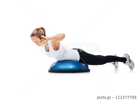 Fitness, half ball and woman in a studio for stretching body workout or training with balance. Sports, equipment and young female person with muscle warm up exercise isolated by white background. 112377788