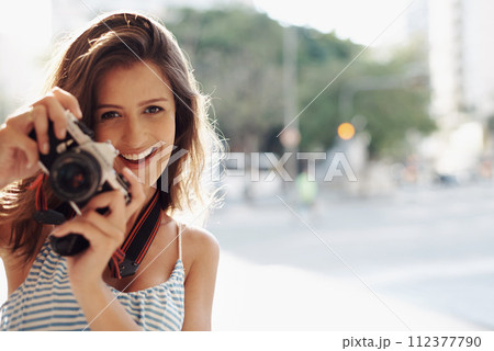 Happy woman, portrait and photography with camera in city street for photo, memory or outdoor moment. Female person, tourist or photographer with smile or lens for picture or sightseeing in town 112377790